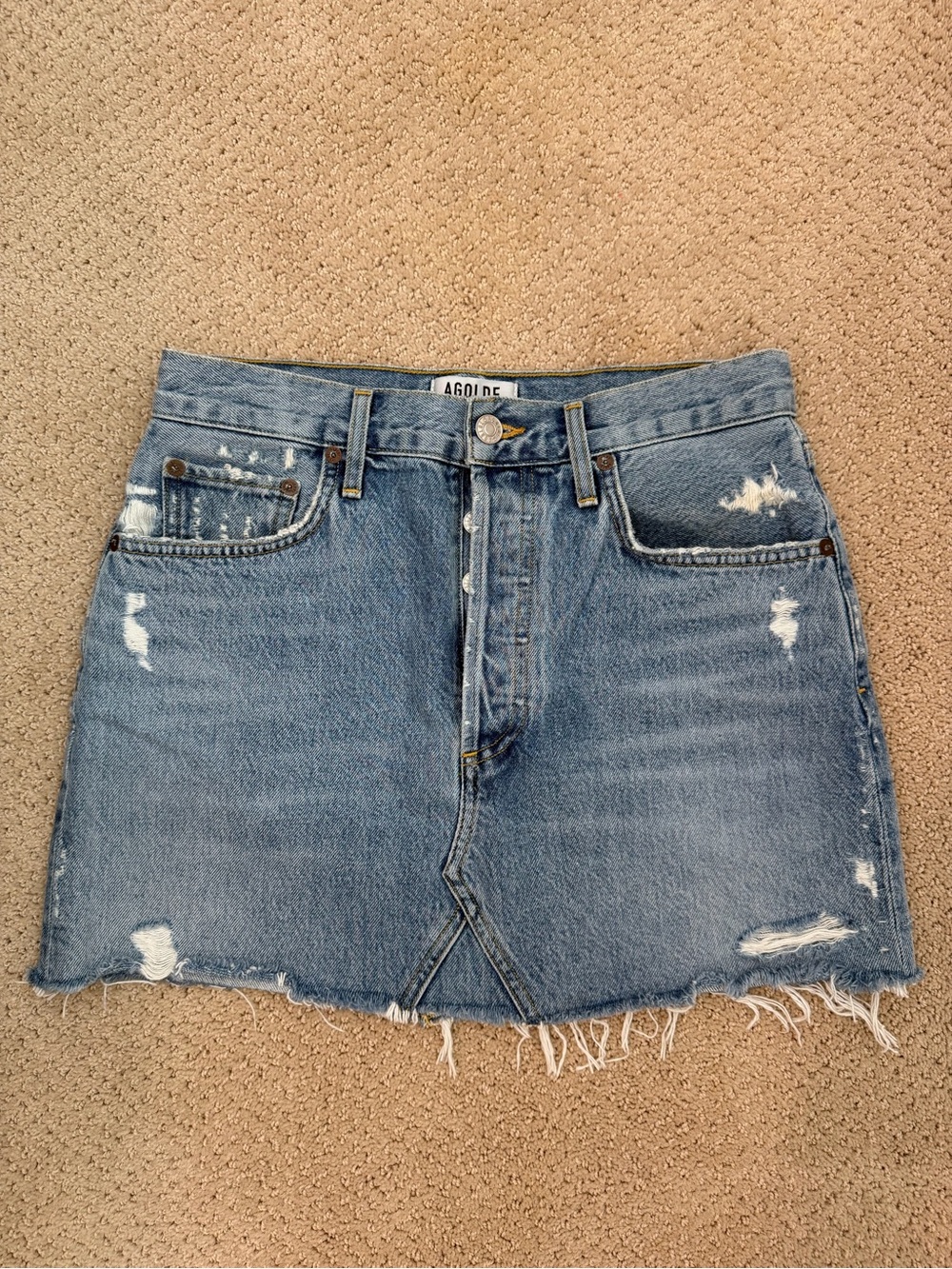 Agolde light blue distressed denim mini skirt with raw hem